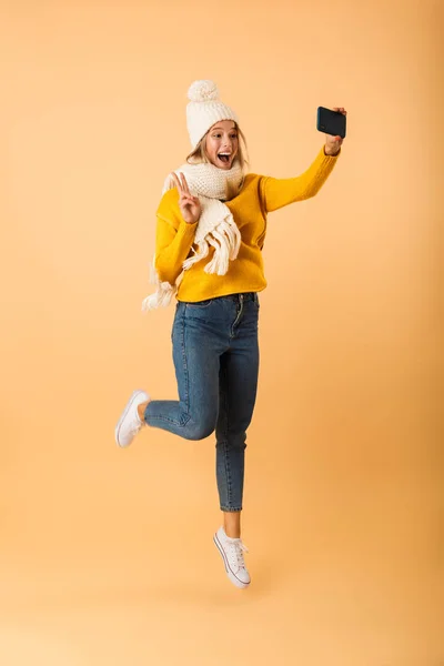 Photo Cute Excited Woman Wearing Scarf Hat Posing Isolated Yellow — Stock Photo, Image