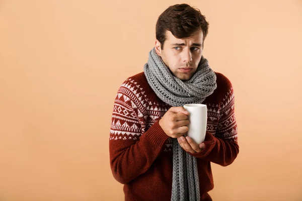 Portrait Sad Young Man Dressed Sweater Scarf Holding Cup Tea — Stock Photo, Image