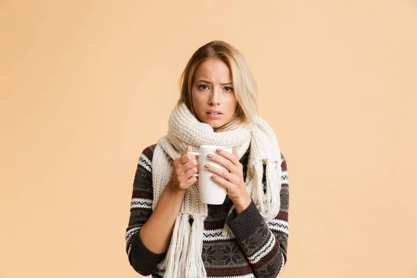 Portrait Upset Girl Dressed Sweater Scarf Isolated Beige Background Holding — Stock Photo, Image