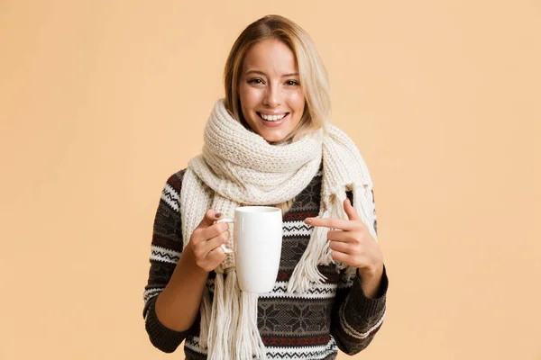 Portrait Happy Girl Dressed Sweater Scarf Isolated Beige Background Holding — Stock Photo, Image