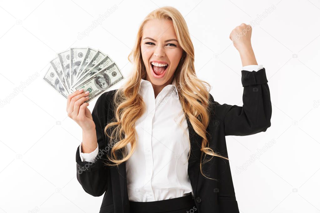 Portrait of businesslike woman wearing office clothing holding fan of money isolated over white background