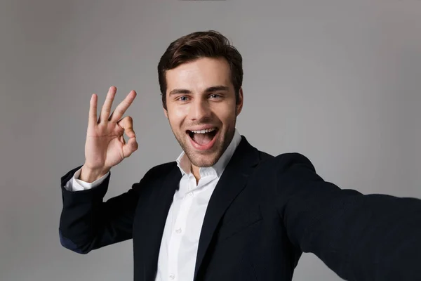 Image Joyous Businessman 30S Formal Suit Showing Sign Camera While — Stock Photo, Image