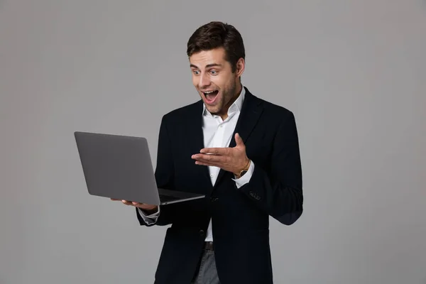 Portrait Excited Young Businessman Dressed Suit Isolated Gray Background Using — Stock Photo, Image