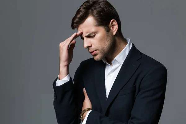 Close Portrait Pensive Young Businessman Dressed Suit Isolated Gray Background — Stock Photo, Image