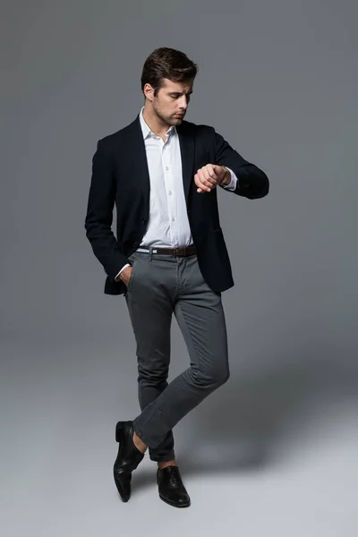 Full Length Portrait Handsome Young Businessman Dressed Suit Isolated Gray — Stock Photo, Image