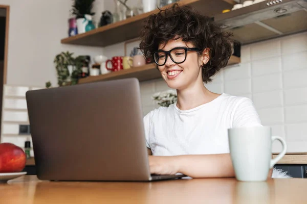 Portrait Smiling Young Woman Wearing Eyeglasses Working Laptop Computer Home — Stock Photo, Image