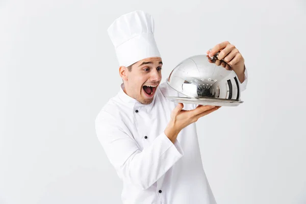 Excited Man Chef Cook Wearing Uniform Opening Cloche Cover Isolated — Stock Photo, Image