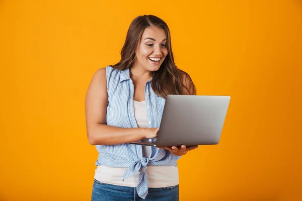 Portrait Happy Young Casual Woman Standing Isolated Yellow Background Holding — Stock Photo, Image