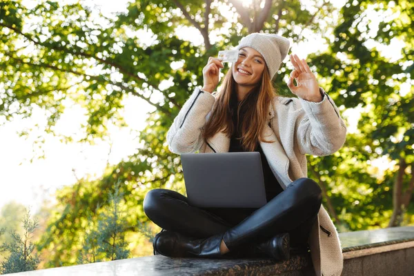 Happy Young Woman Dressed Autumn Coat Hat Sitting Outdoors Using — Stock Photo, Image