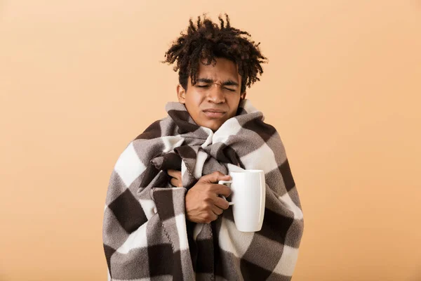 Close Portrait Sad Young African Man Wrapped Blanket Isolated Beige — Stock Photo, Image