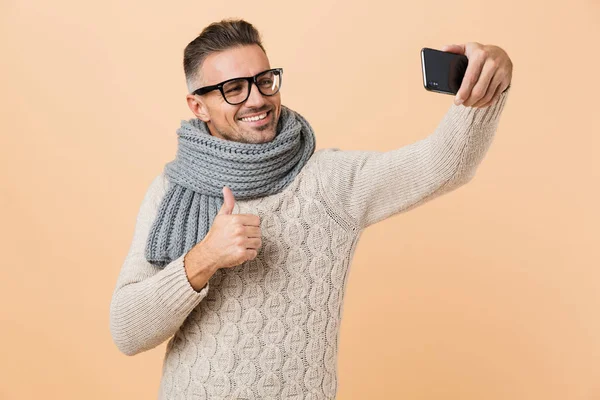 Portrait Smiling Man Dressed Sweater Scarf Standing Isolated Beige Background — Stock Photo, Image