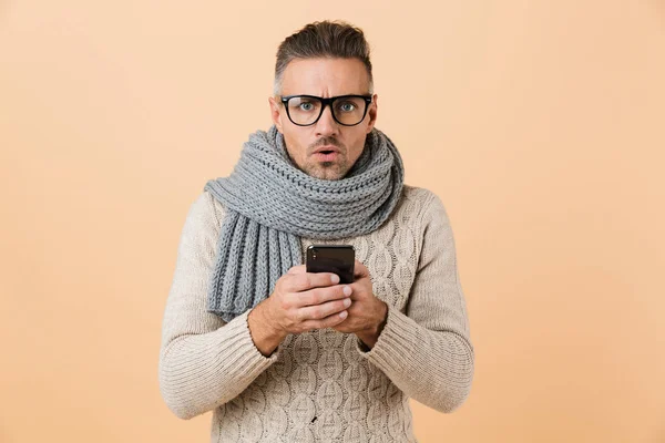 Portrait Shocked Man Dressed Sweater Scarf Standing Isolated Beige Background — Stock Photo, Image