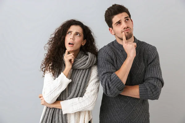 Image Concentrated Man Woman Looking Aside While Thinking Isolated Gray — Stock Photo, Image