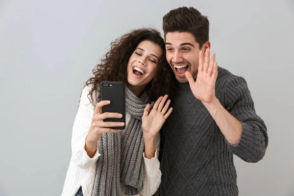 Cheerful Couple Wearing Sweaters Standing Isolated Gray Background Making Video — Stock Photo, Image