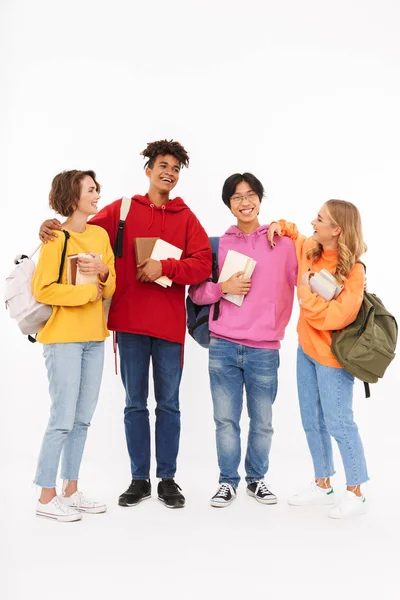 Grupo Adolescentes Alegres Aislados Sobre Fondo Blanco Llevando Mochilas Sosteniendo — Foto de Stock