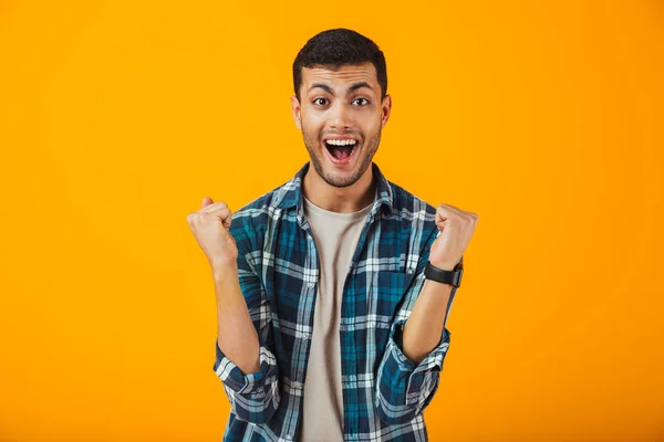 Joven Alegre Con Camisa Cuadros Pie Aislado Sobre Fondo Naranja —  Fotos de Stock