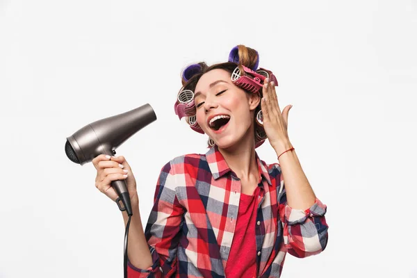 Cheerful Housewife Curlers Hair Standing Isolated White Background Using Hairdryer Royalty Free Stock Images