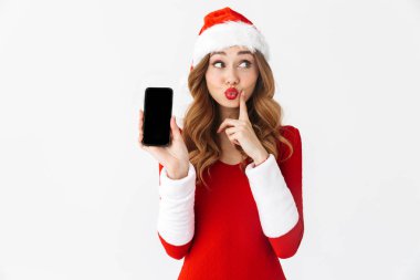 Bir güzel duygusal kadın Noel kostümü cep telefonu görüntüsünü gösteren resim.