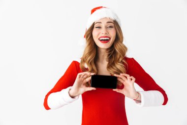 Bir güzel duygusal kadın Noel kostümü cep telefonu görüntüsünü gösteren resim.