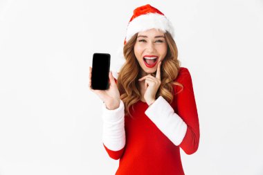 Bir güzel duygusal kadın Noel kostümü cep telefonu görüntüsünü gösteren resim.