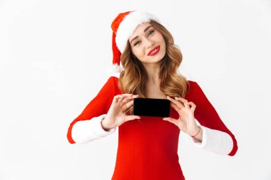 Bir güzel duygusal kadın Noel kostümü cep telefonu görüntüsünü gösteren resim.