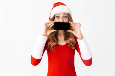 Cep telefonu ağız kapsayan görüntüsünü gösterilen yılbaşı kostüm şok bir duygusal kadın fotoğrafı.