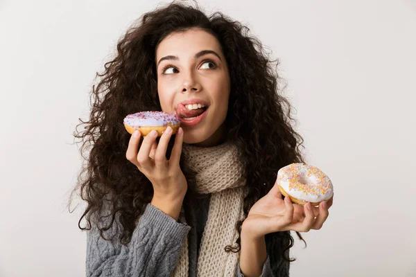 Attractive Young Woman Wearing Winter Scarf Showing Sweet Donuts While — Stock Photo, Image