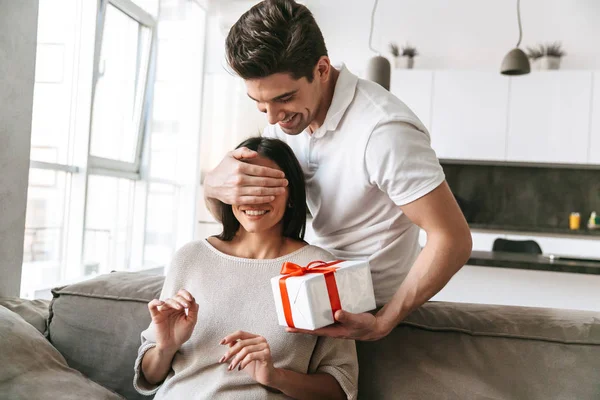 Happy Lovely Young Couple Celebrating Together While Sitting Couch Home — Stock Photo, Image