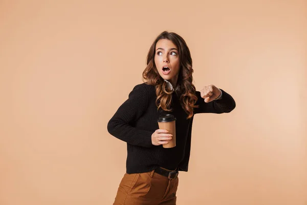 Shocked Young Woman Wearing Sweater Running Late Isolated Beige Background — Stock Photo, Image