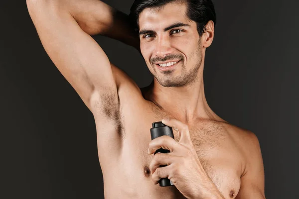 Handsome Shirtless Man Standing Isolated Black Background Spraying Deodorant His — Stock Photo, Image