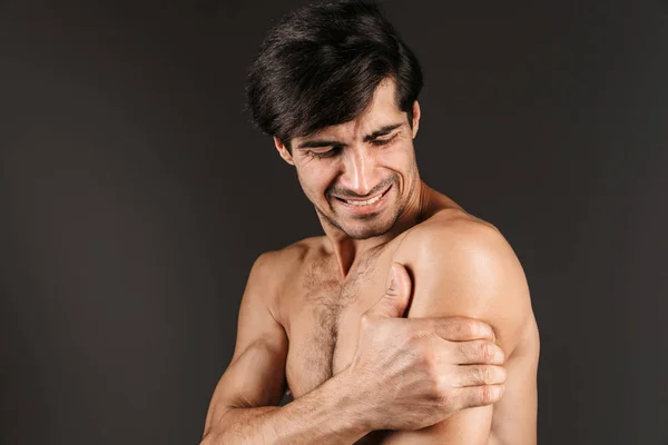 Image Sad Displeased Young Man Arm Pain Posing Isolated Dark — Stock Photo, Image