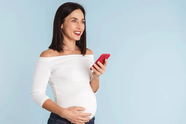Foto Una Joven Embarazada Aislada Sobre Fondo Pared Azul Usando — Foto de Stock