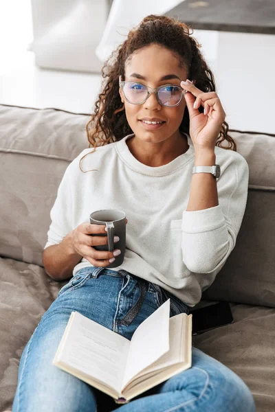 Image Stylish African American Girl Reading Book Drinking Tea While — Stock Photo, Image