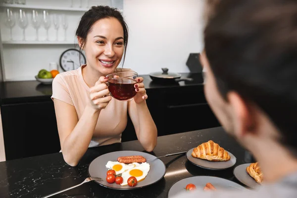 Image Young Happy Loving Couple Indoors Home Kitchen Have Breakfast — Stock Photo, Image