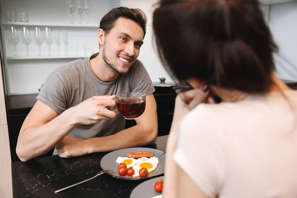 Image Young Happy Loving Couple Indoors Home Kitchen Have Breakfast — Stock Photo, Image