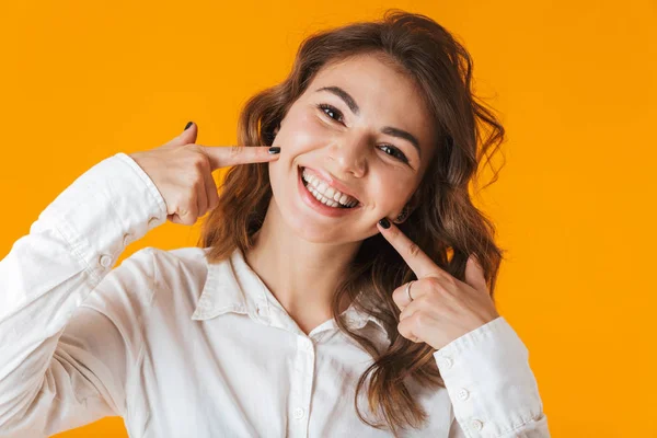 Portrait of a cheerful young woman wearing white shirt — Stock Photo, Image