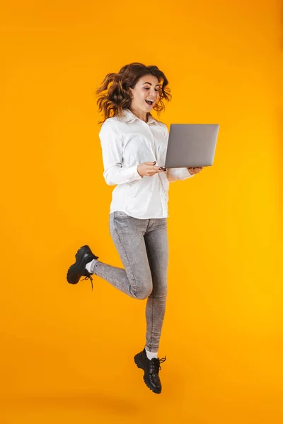Full length portrait of a cheerful young woman — Stock Photo, Image