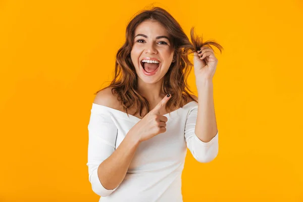 Portrait of a cheerful young woman wearing white shirt — Stock Photo, Image