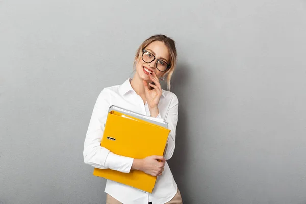 Photo of smart secretary wearing glasses holding paper folders i — Stock Photo, Image