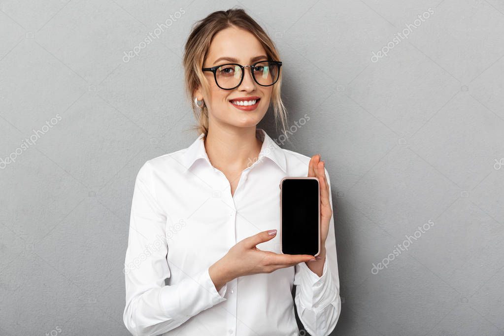 Portrait of european businesswoman wearing glasses smiling and h