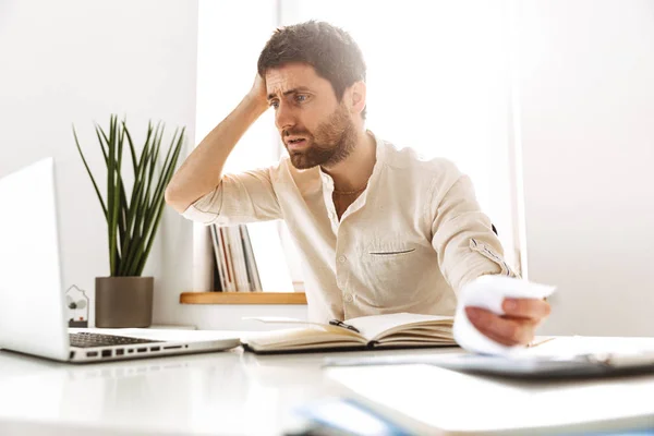 Portrait of stressed businessman 30s wearing white shirt working — Stock Photo, Image