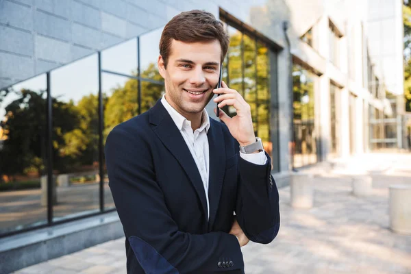 Handsome young business man wearing suit — Stock Photo, Image