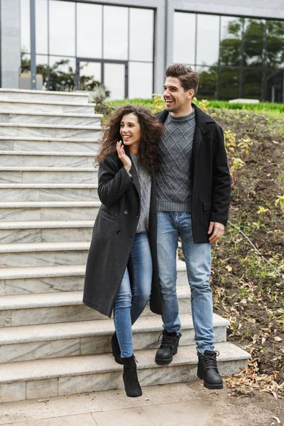 Full length photo of lovely couple man and woman 20s in warm clo — Stock Photo, Image