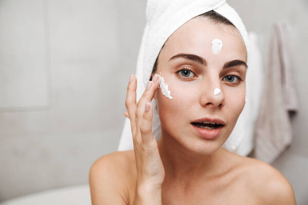 Close up of a beautiful young woman with towel