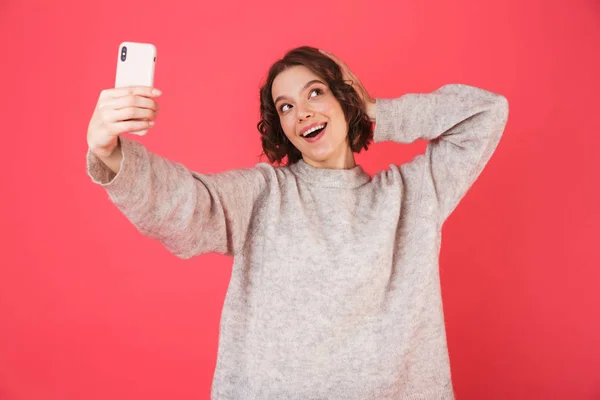 Portrait of a cheerful young woman standing — Stock Photo, Image