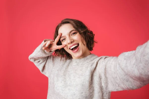 Portrait of a cheerful young woman standing — Stock Photo, Image