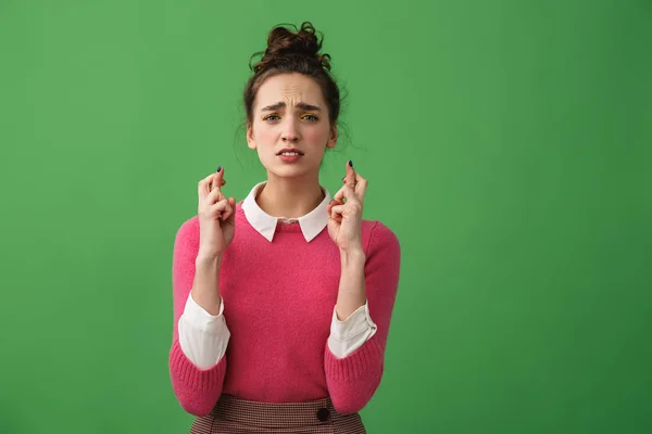 Portrait of a worried woman holding fingers — Stock Photo, Image