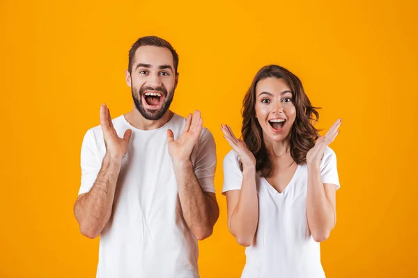 Portrait of surprised people man and woman in basic clothing smi — Stock Photo, Image