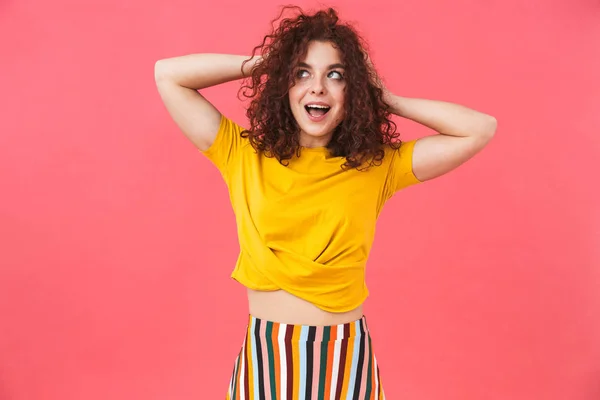 Photo of readhead woman 20s with curly hair standing and smiling — Stock Photo, Image