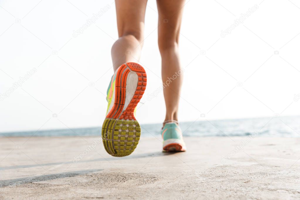 Back view of women's legs running